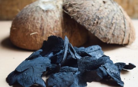 What is the process of making coconut shell charcoal?